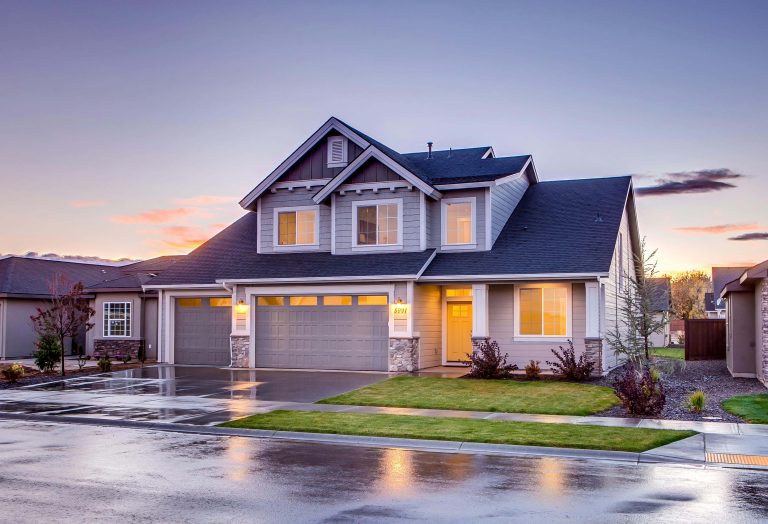 A clean driveway and walkway in front of a home