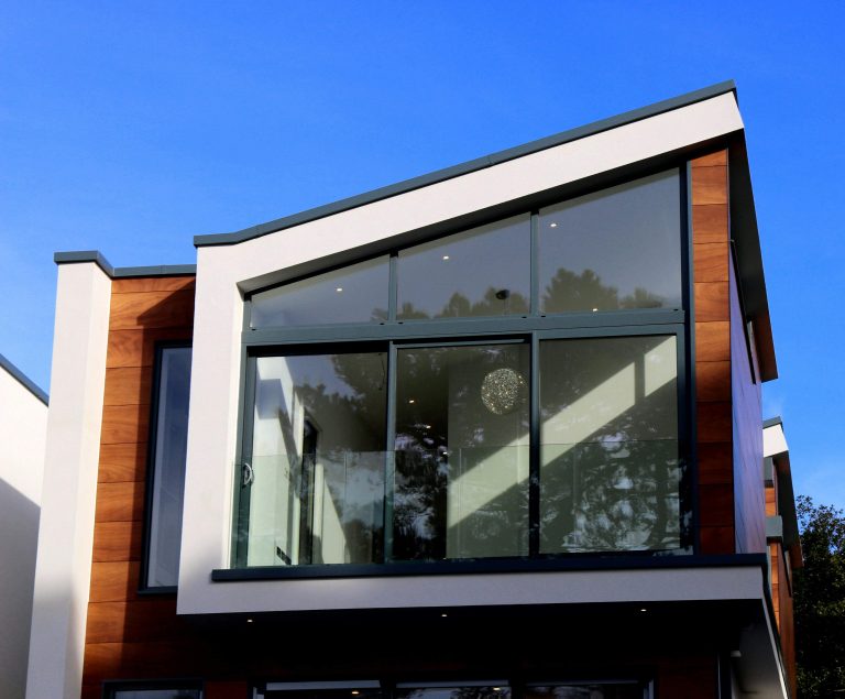 Cleaning a home window with a squeegee